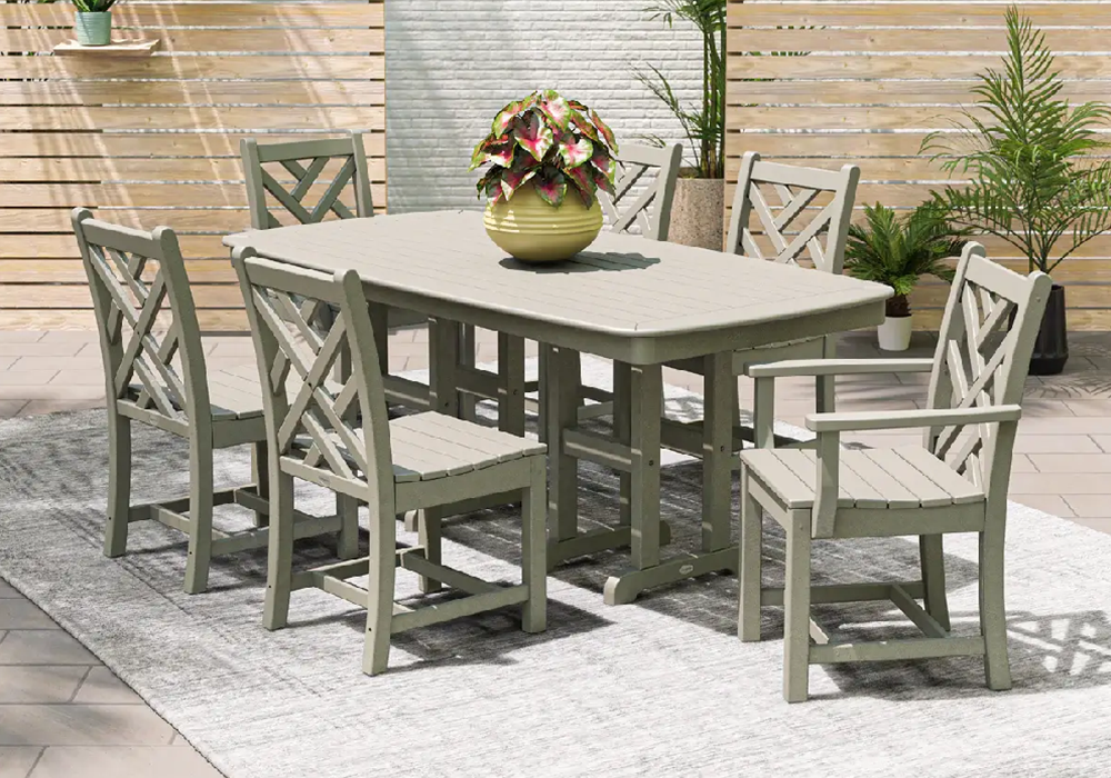 Elegant outdoor dining area featuring a gray Chippendale-style dining set for upscale patios and hospitality spaces.